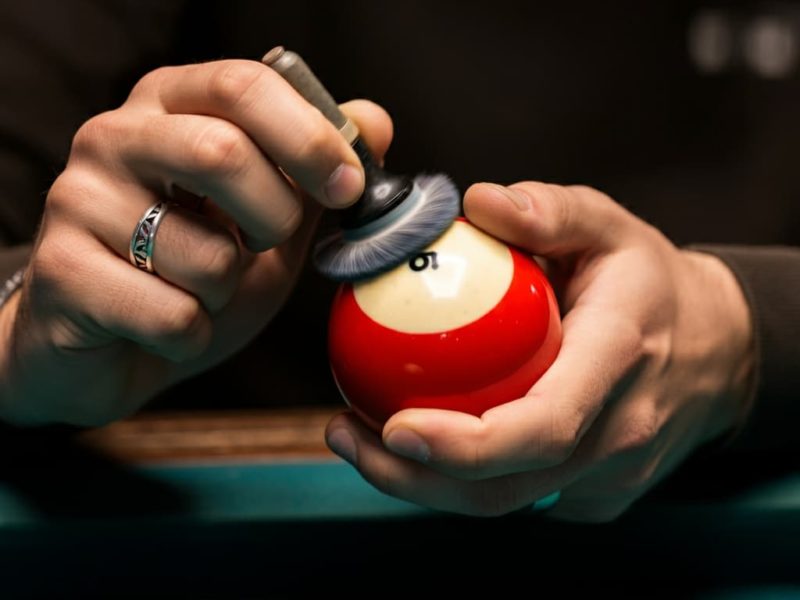 striped ball being polished and cleaned