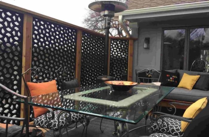 Privacy screen being used to shield a patio dining area