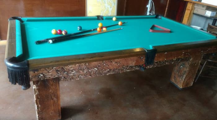 Ugly beat up used billiard table