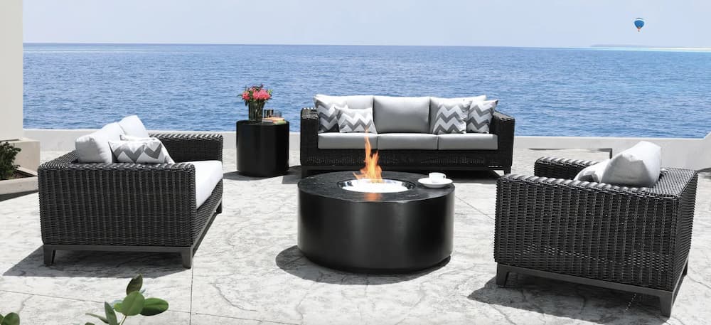 wicker patio furniture around a fire pit table