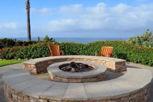 stone bench as outdoor seating around a fire pit