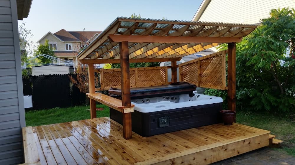 Cedar deck with a small hot tub and gazebo/pergola