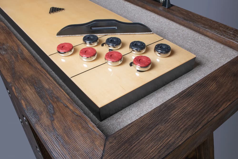 Beautifully crafted shuffleboard is one of the games for a man cave