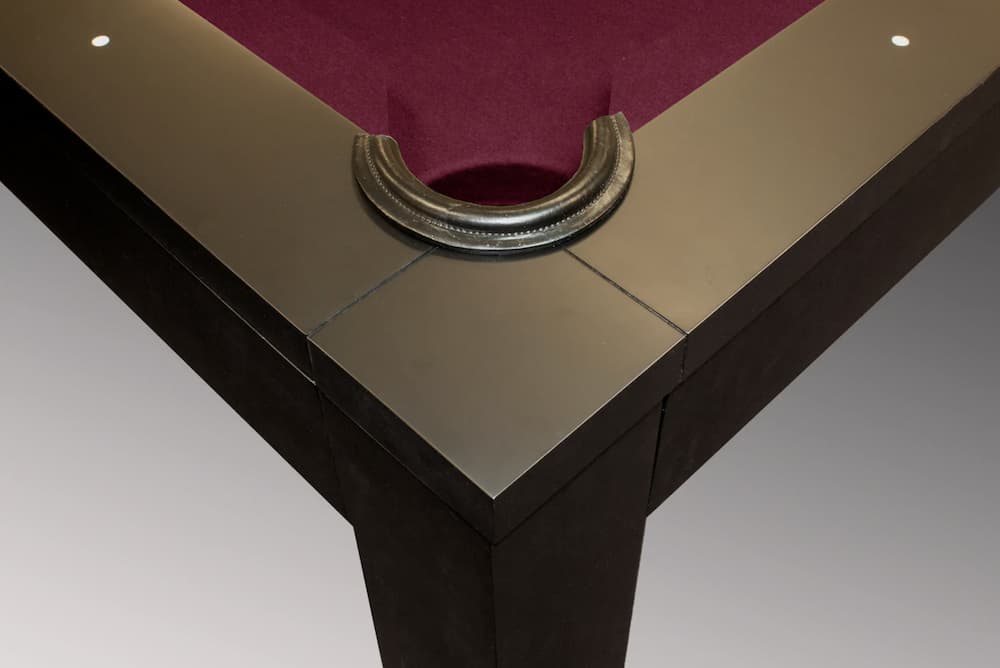 corner pocket closeup of pool table